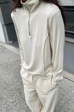 QUARTER ZIP SLEEVE TOP